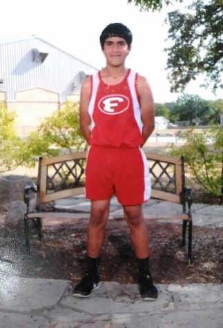 Freshman Kevin Rivas poses for his first ever high school cross country photo.