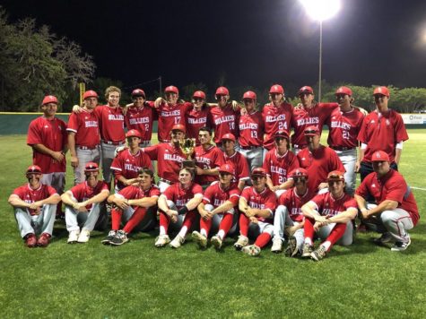The Billie baseball team proudly holds the district championship trophy after beating Boerne 10-3.