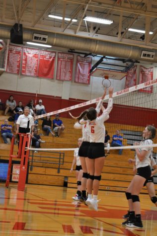 The Billies go up for a block against La Vernia.