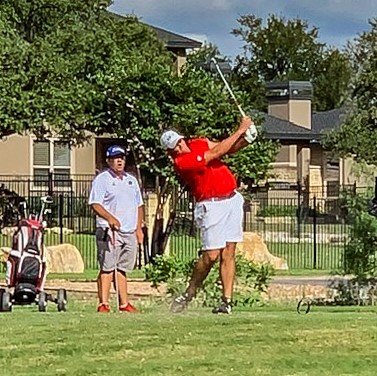 Denver Schneider tees off on a par three at the Smithson Valley Stampede at River Crossing tournament.