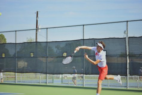 Senior Levi Wilkins hit a serve against district opponent, Canyon Lake.