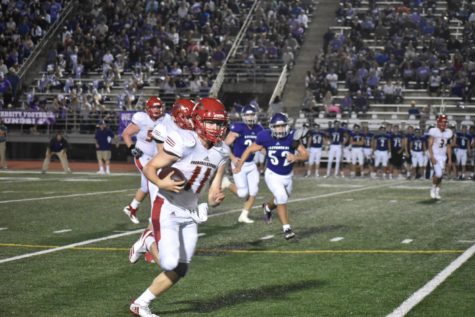 Quarterback Brant Bowers sprints past the Bulldog Defense for a first down.