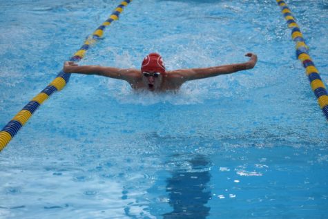 Zach Willis finishes out the Men's 100 Butterfly strong.