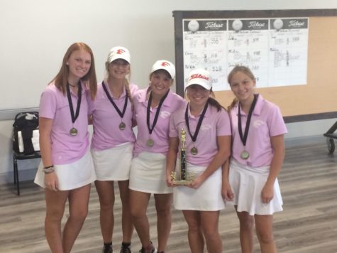 Autumn Pyka, Allison James, Grace Grona, Madilyn Embrey, and Kayla Feller pose with their trophy after winning the Steele Invitational on Oct. 29.