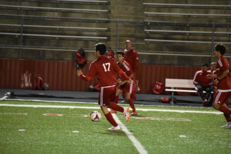 Billies varsity player 17 gears up to kick the soccer ball.
