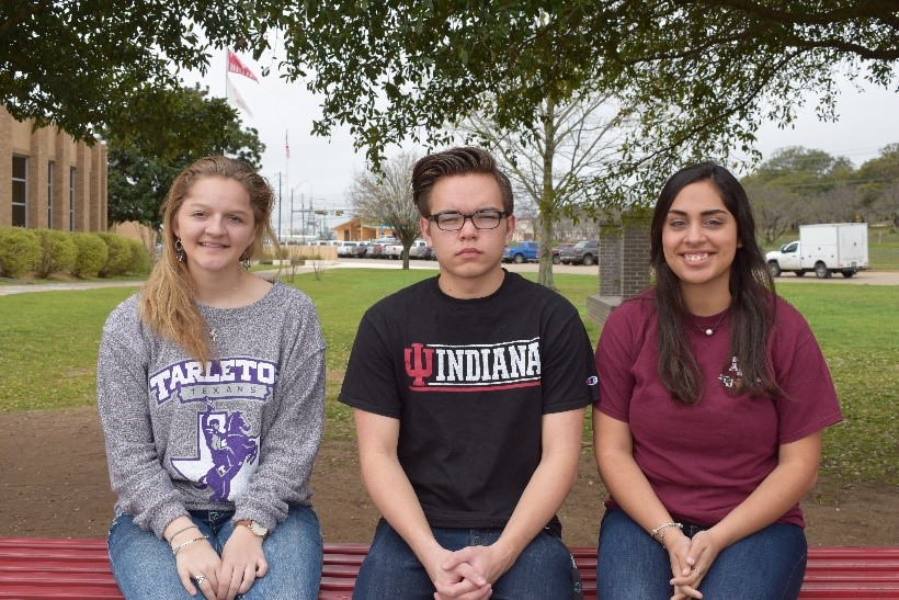 Kamryn+Manley%2C+Bryce+Pearrow+and+Jenna+Najera+sport+their+college+shirts.
