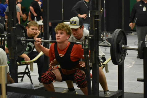 Freshman John Tewksbury squats during the Lago Vista meet.