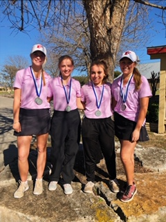 Allison James, Kayla Feller, Madelyn Embrey and Grace Grona smile with their medals after placing second at Flying L golf course.
