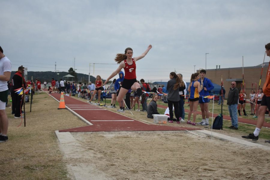 Aleah Constantine flies over the long jump pit during her event at the Kerrville track meet. 